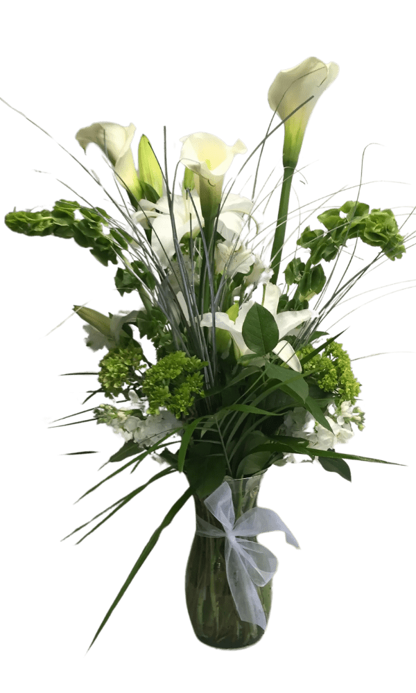 Untitled design A bouquet of flowers in a vase on a table.