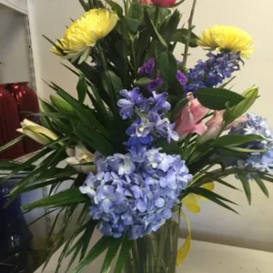 A vase filled with flowers on top of a table.