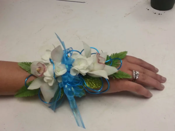 A hand with flowers and leaves on it
