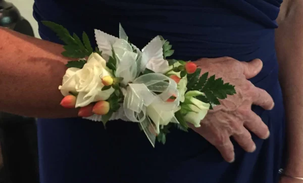 A person 's hand with flowers on it.