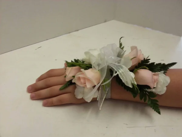 A hand with flowers on it is shown.