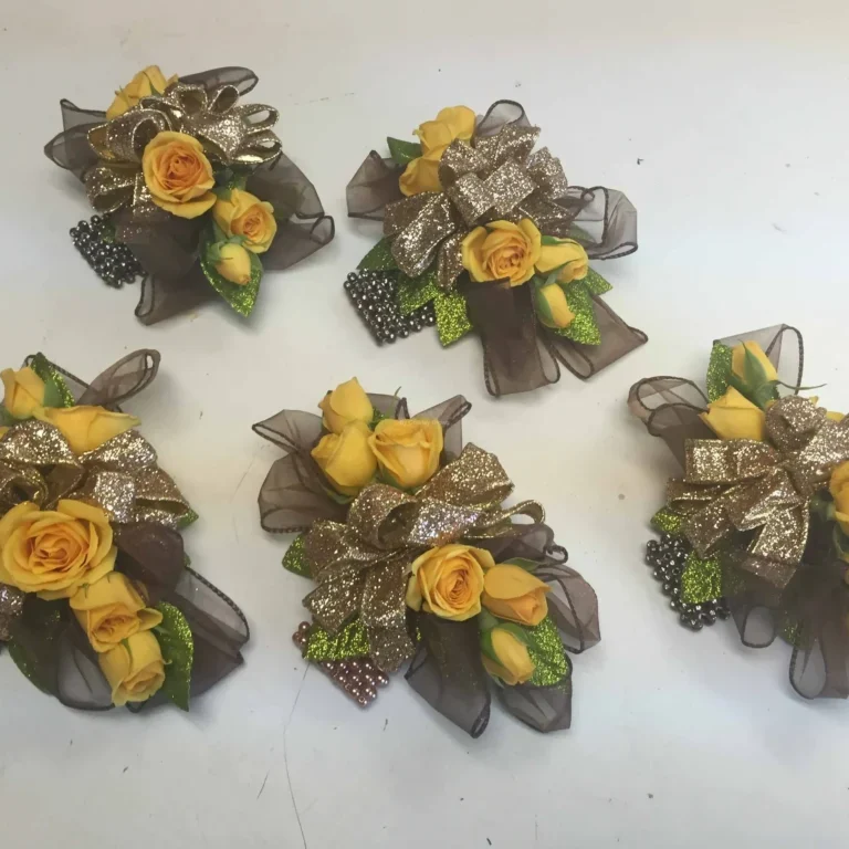 A group of yellow flowers with green leaves.