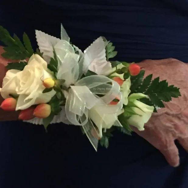 A person 's hand with flowers on it.