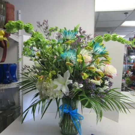 A vase filled with flowers on top of a table.