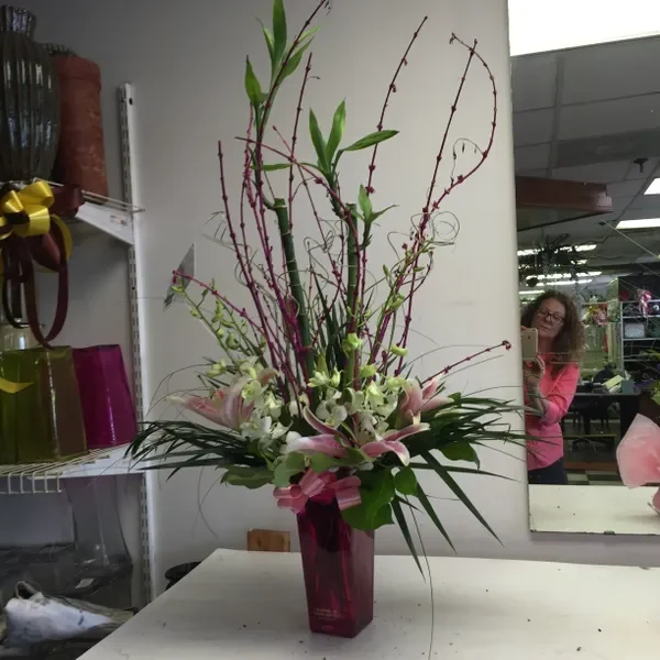 A vase of flowers on top of a table.
