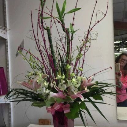 A vase filled with flowers on top of a table.
