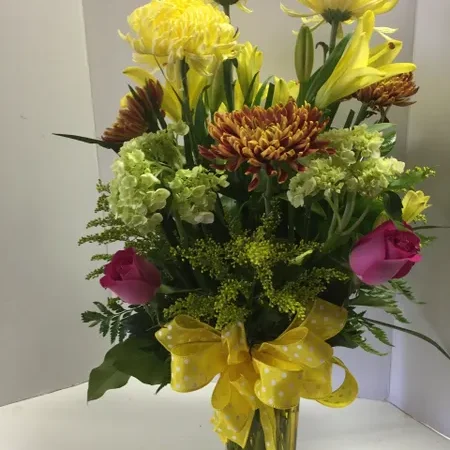 A vase filled with flowers on top of a table.