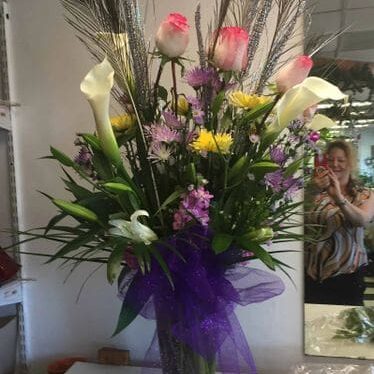 A vase filled with flowers on top of a table.
