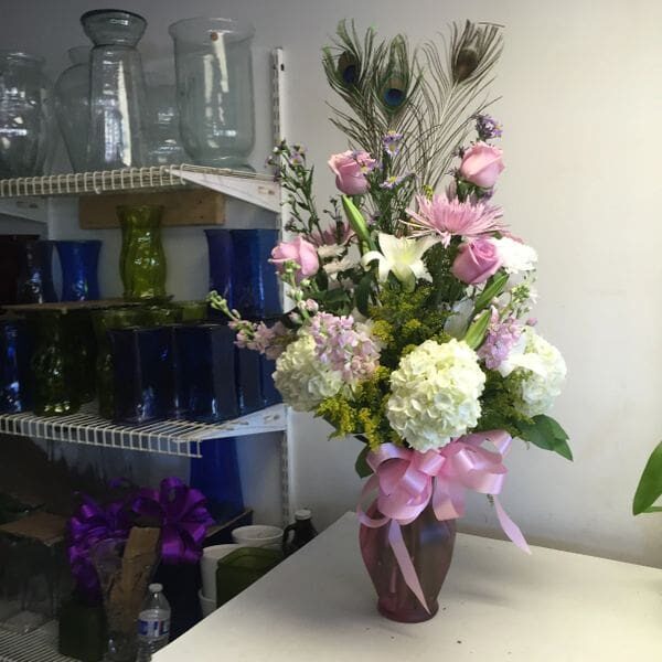 A vase of flowers on top of a table.