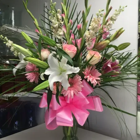 A vase filled with flowers on top of a table.