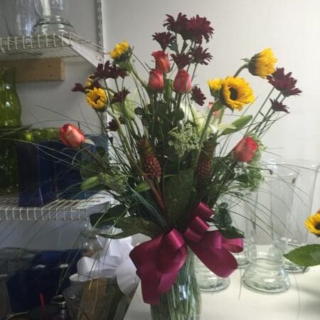 A vase filled with flowers on top of a table.