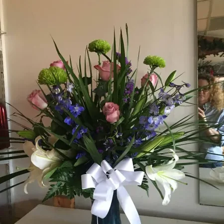 A vase filled with flowers on top of a table.