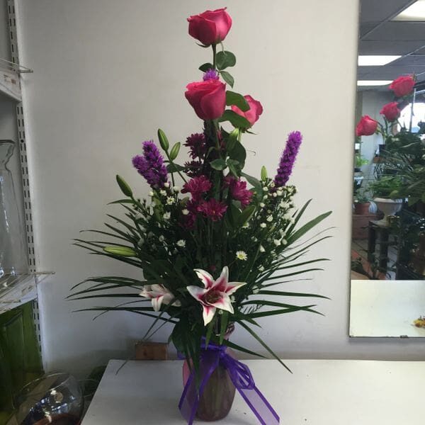 A vase of flowers on top of a table.