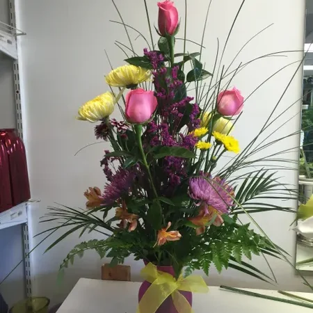 A vase filled with flowers on top of a table.