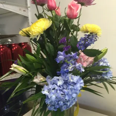A vase filled with flowers on top of a table.