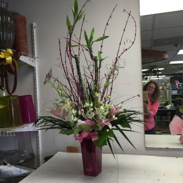 A vase of flowers on top of a table.