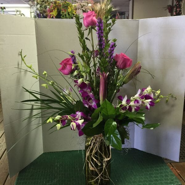 A vase filled with flowers on top of a table.