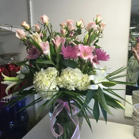 A vase filled with flowers on top of a table.