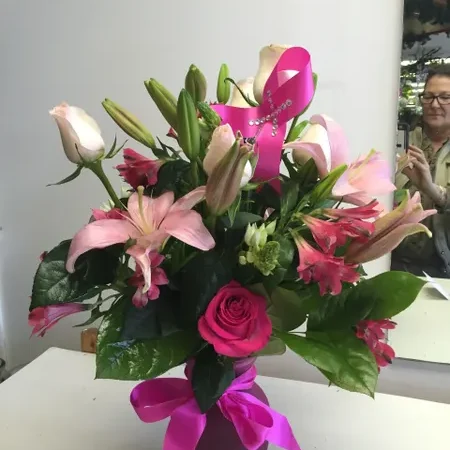 A vase of flowers on top of a table.