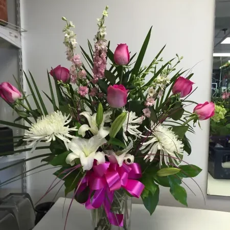 A vase filled with flowers on top of a table.