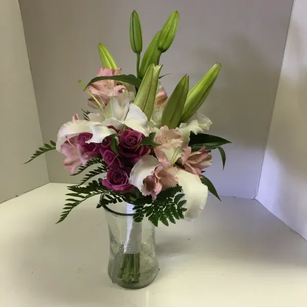 A vase filled with flowers on top of a table.