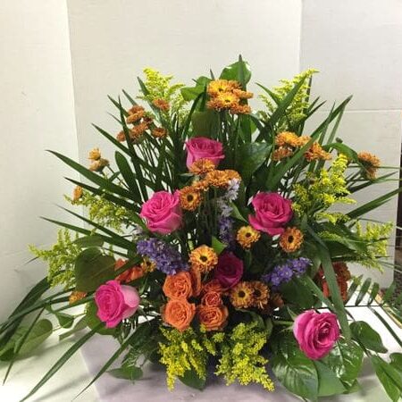 A bouquet of flowers sitting on top of a table.