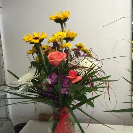 A vase filled with flowers on top of a table.