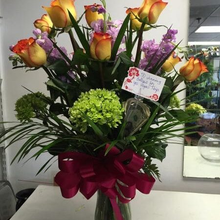 A vase filled with flowers on top of a table.