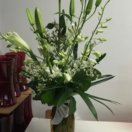 A vase filled with flowers on top of a table.