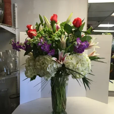 A vase filled with flowers on top of a table.