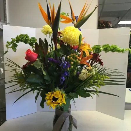 A vase filled with flowers on top of a table.