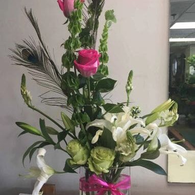 A vase filled with flowers on top of a table.
