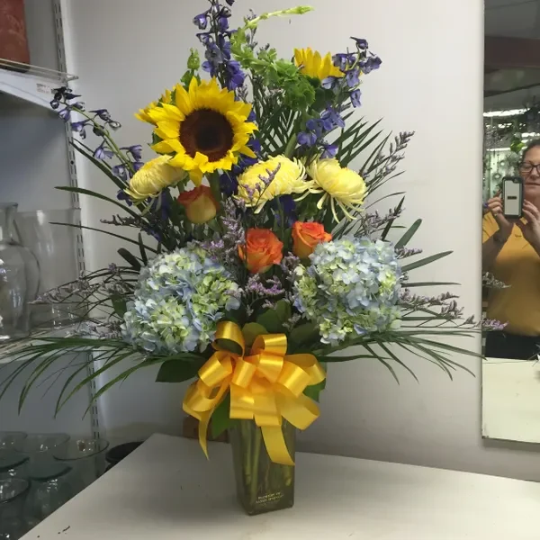 A vase filled with flowers on top of a table.